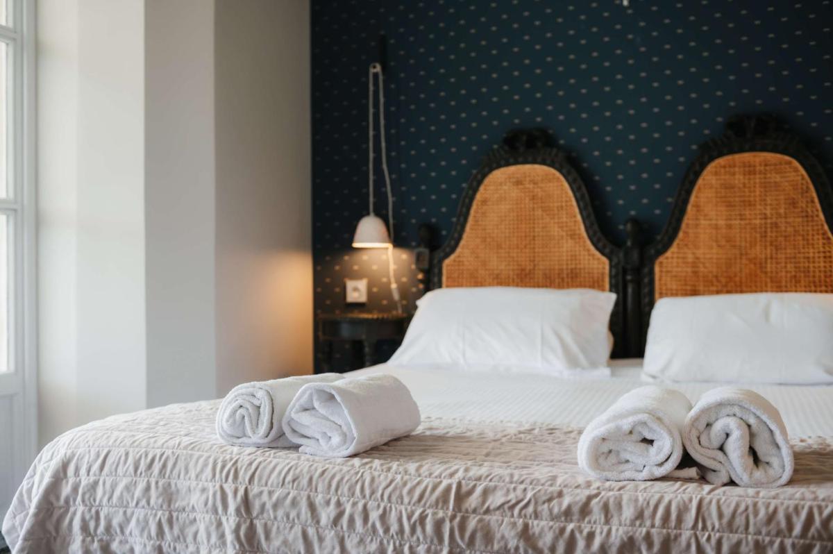 Un ou plusieurs lits dans un hébergement de l'établissement Hôtel La Robéyère - BW Signature Collection