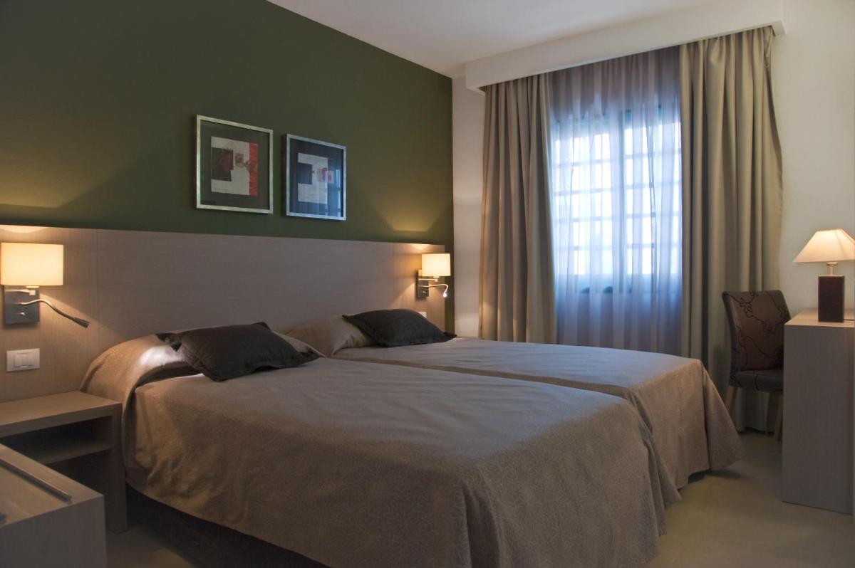 Cama o camas de una habitación en Relaxia Lanzasur Club - Aqualava Water Park