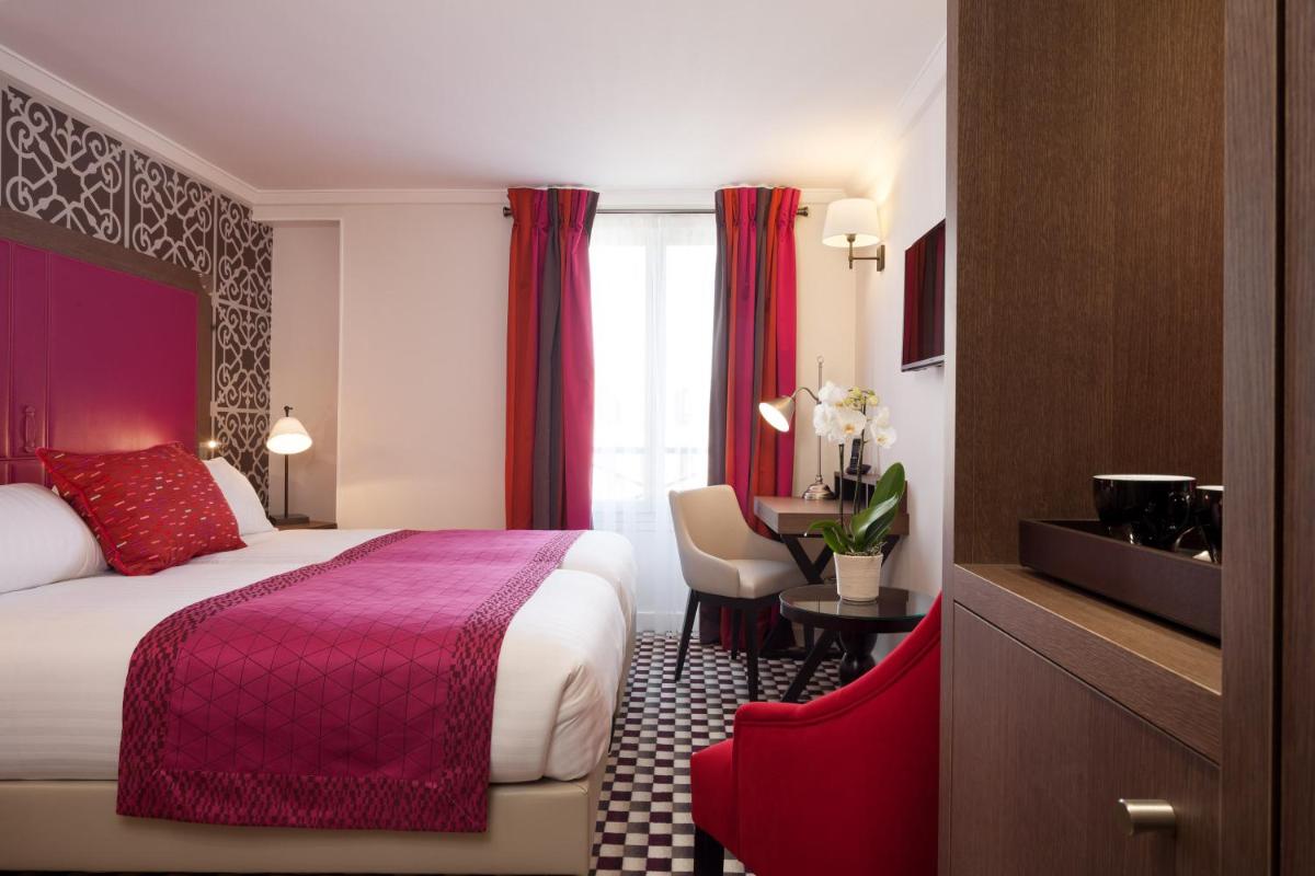 Un ou plusieurs lits dans un hébergement de l'établissement Hotel Phileas Lazare & Spa - Opera