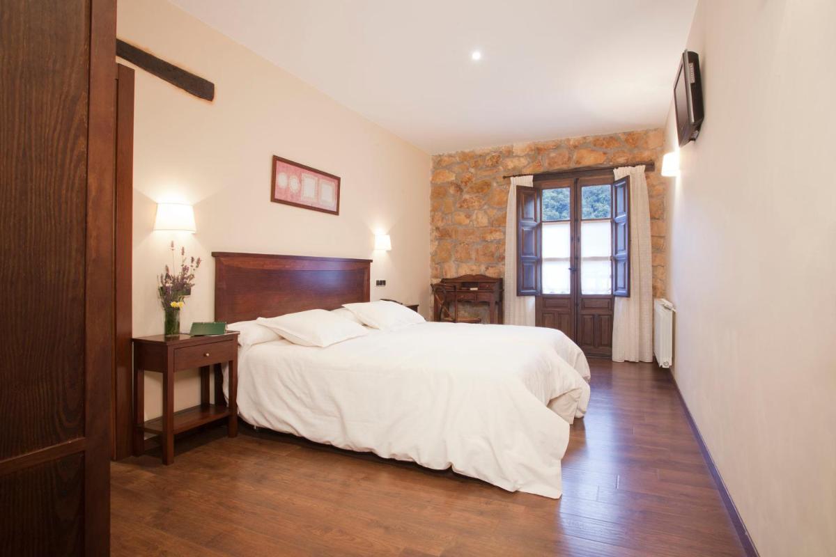 Cama o camas de una habitación en Hotel Rural El Fundil