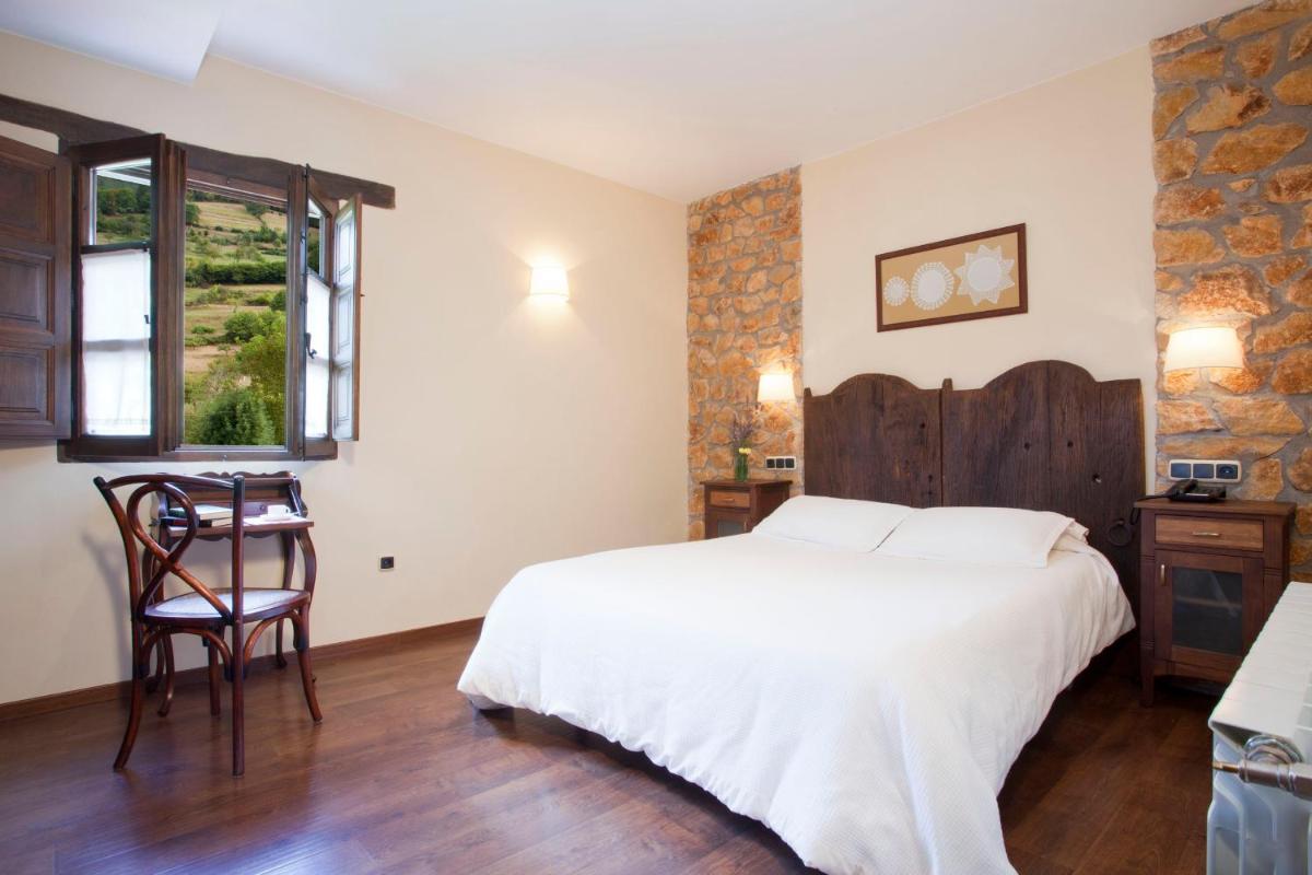 Cama o camas de una habitación en Hotel Rural El Fundil