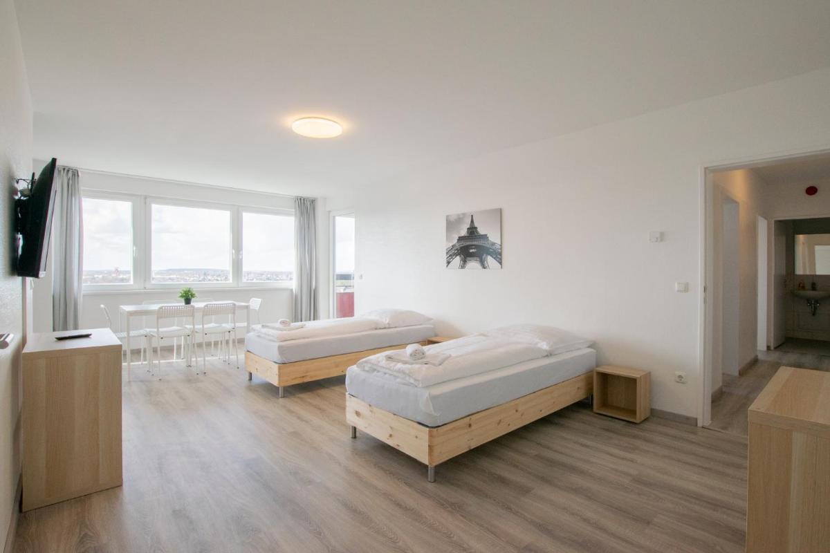 T&K Apartments Comfortable 3 Room Apartments with Balcony - Housity