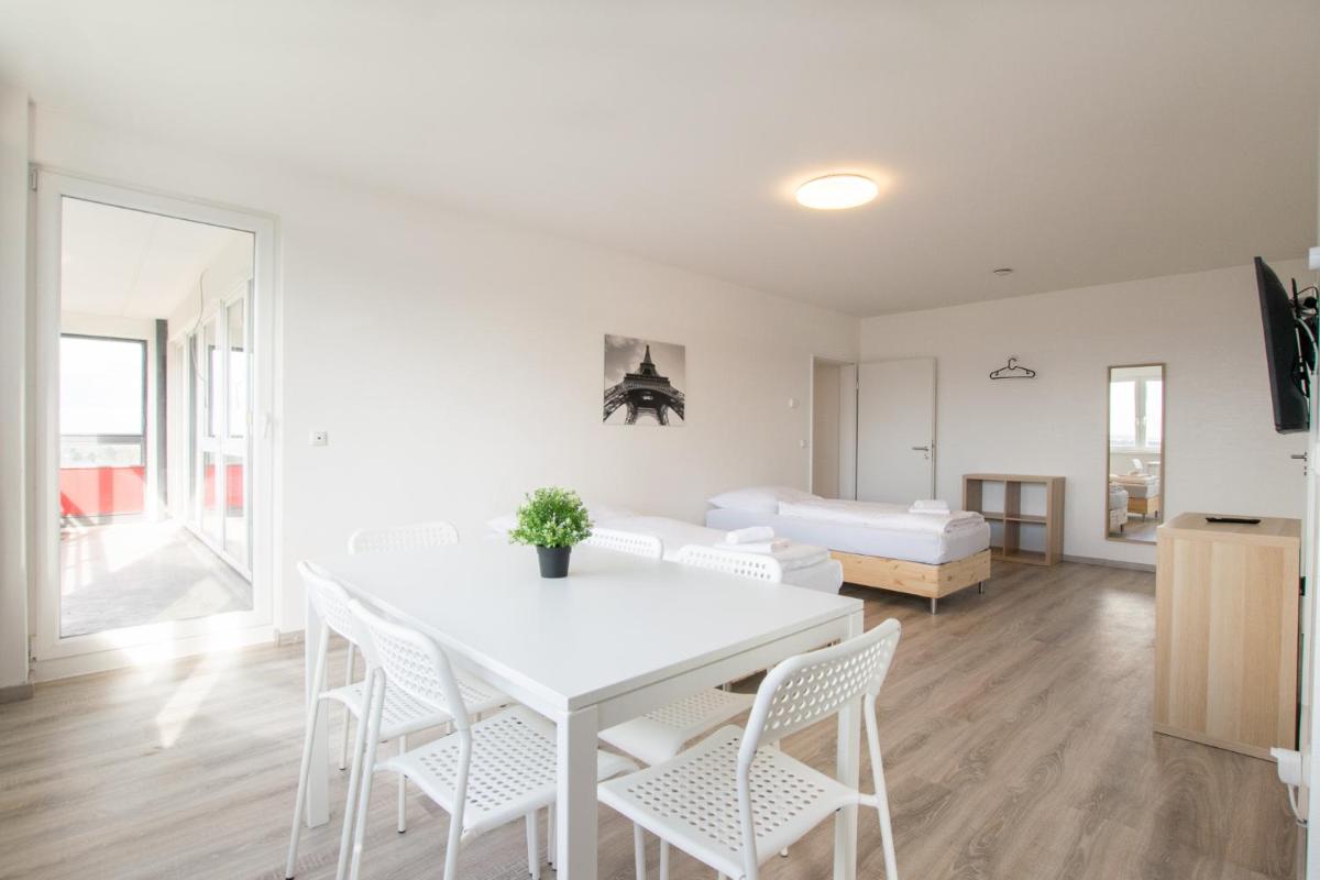 T&K Apartments Comfortable 3 Room Apartments with Balcony - Housity