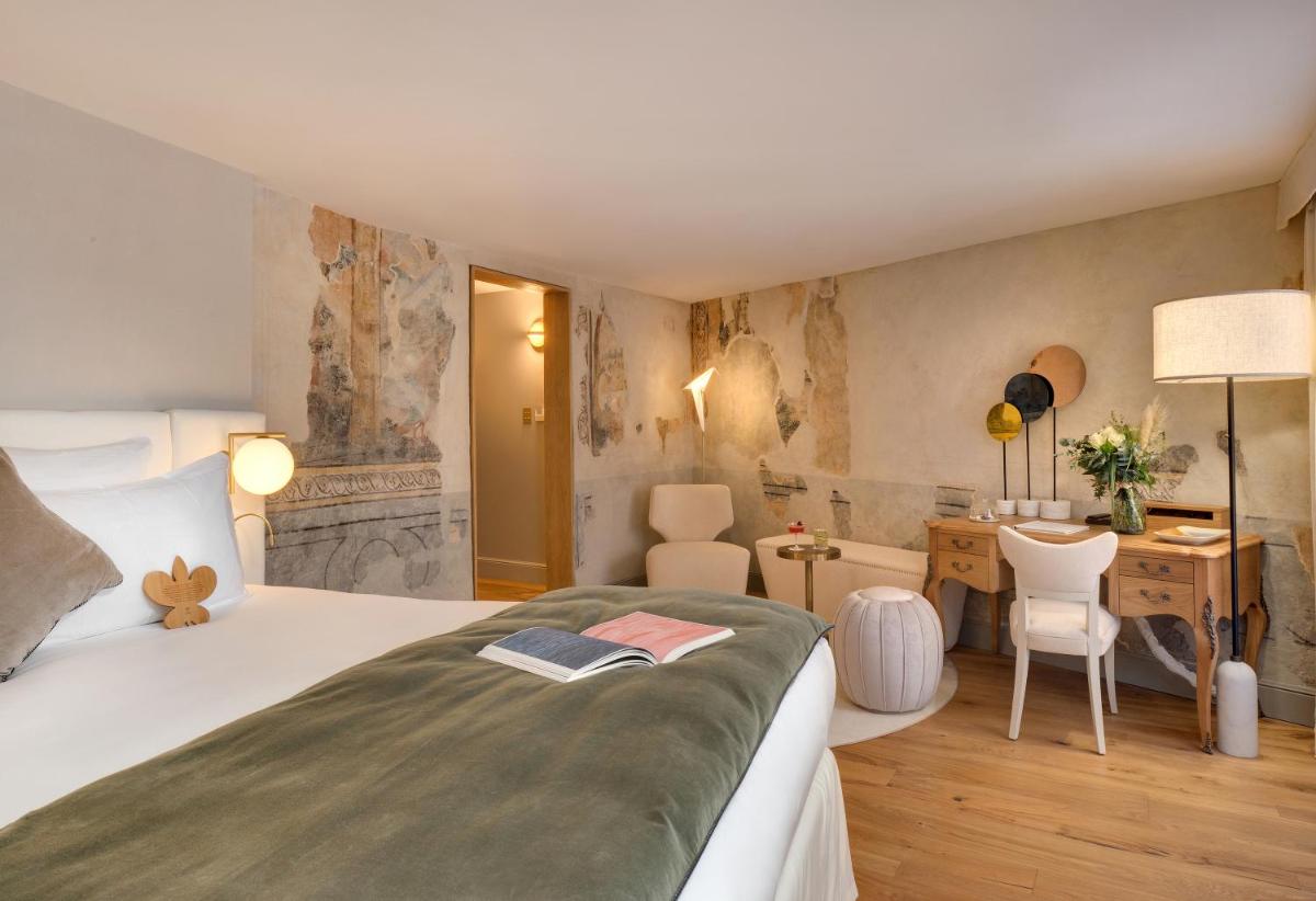 Un ou plusieurs lits dans un hébergement de l'établissement Hôtel Richer De Belleval - Relais & Châteaux