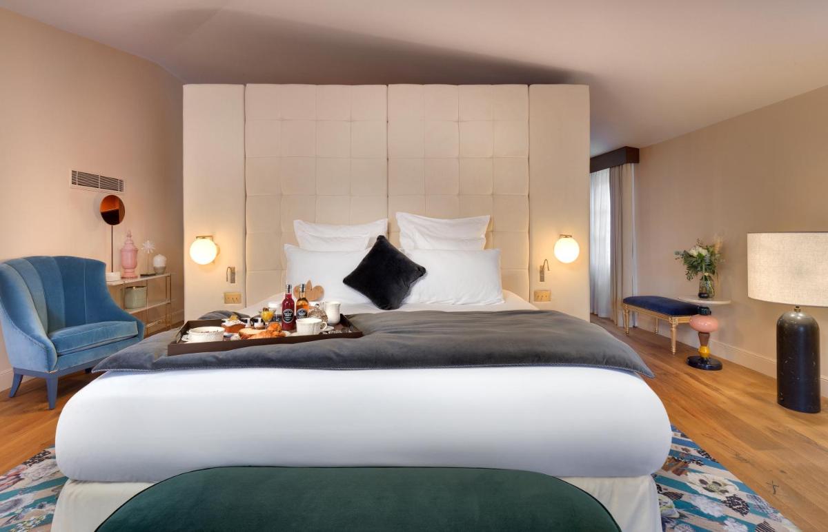 Un ou plusieurs lits dans un hébergement de l'établissement Hôtel Richer De Belleval - Relais & Châteaux