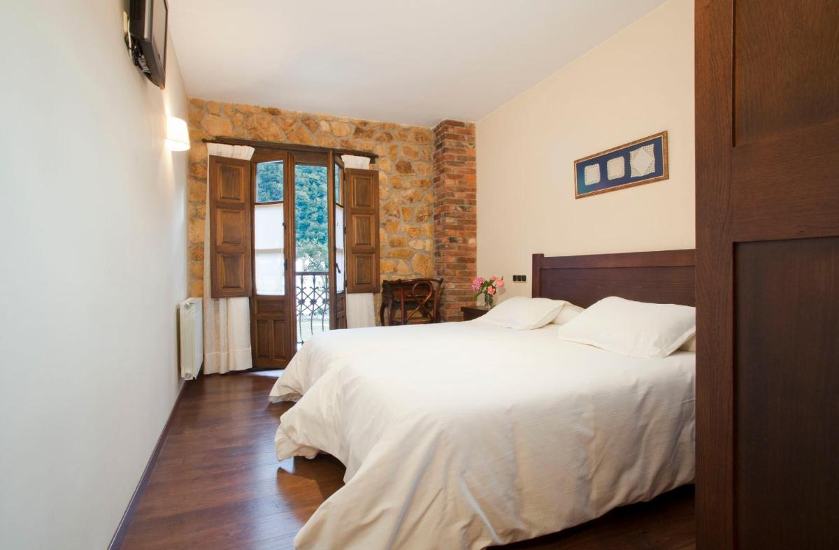 Cama o camas de una habitación en Hotel Rural El Fundil