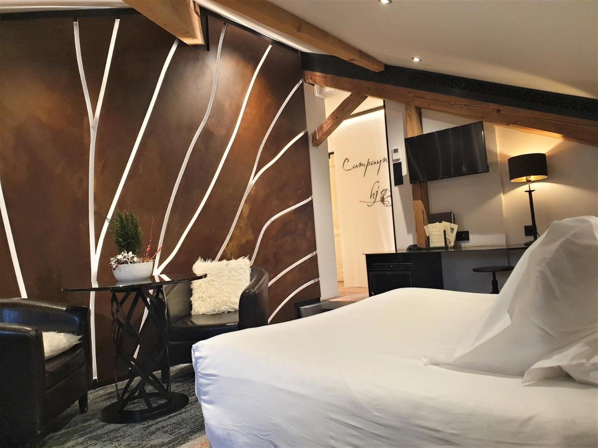 Un ou plusieurs lits dans un hébergement de l'établissement Domaine du Haut Jardin Hôtel & Chalets Spa Privé