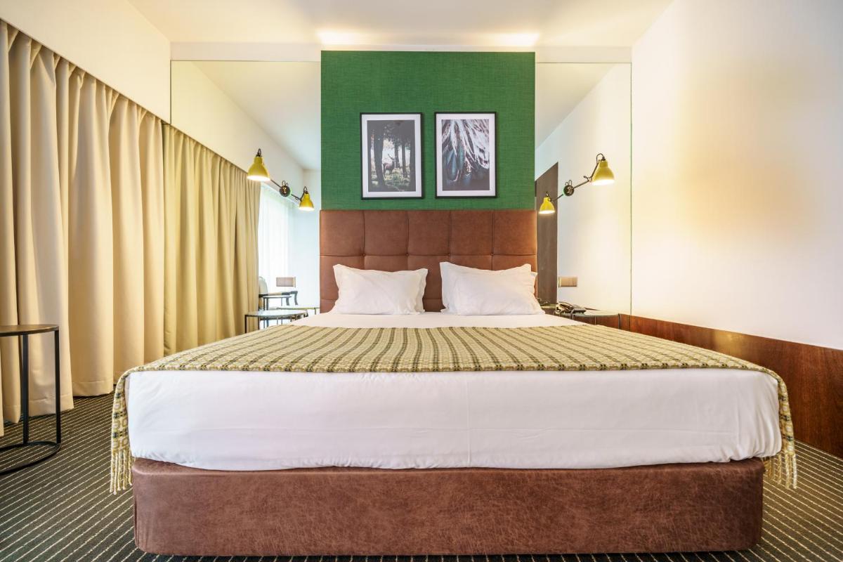 Uma cama ou camas num quarto em Monte Real - Hotel, Termas & Spa