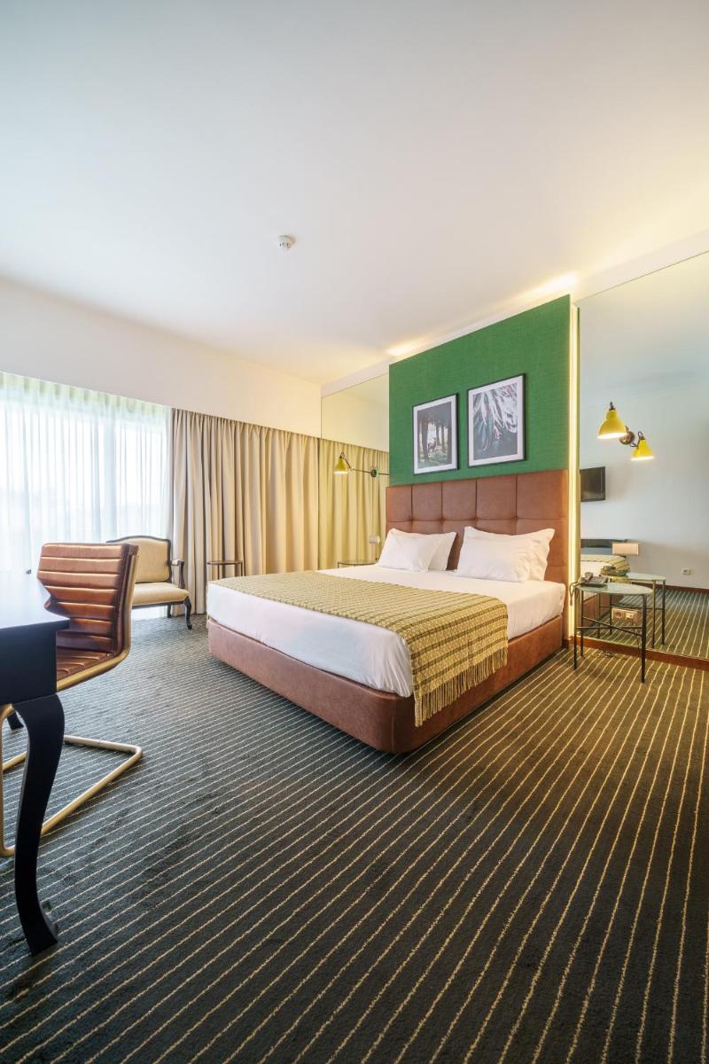 Uma cama ou camas num quarto em Monte Real - Hotel, Termas & Spa