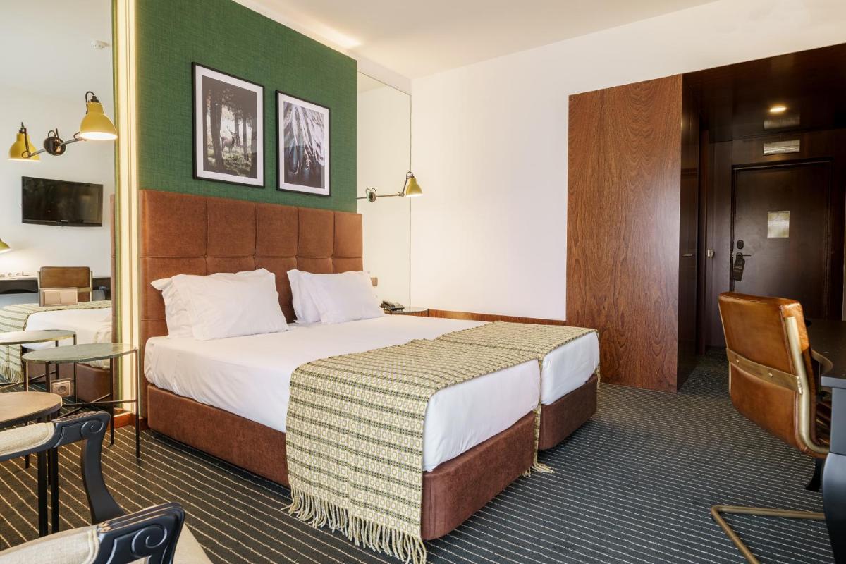 Uma cama ou camas num quarto em Monte Real - Hotel, Termas & Spa