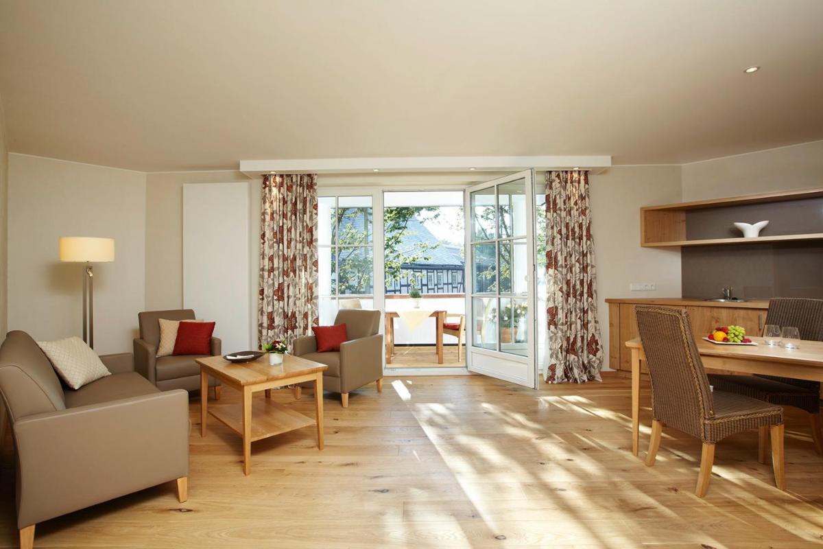 Ein Sitzbereich in der Unterkunft Hotel Deimann