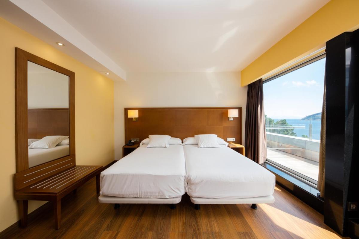 Cama o camas de una habitación en Hotel Thalasso Cantabrico Las Sirenas 4 Superior