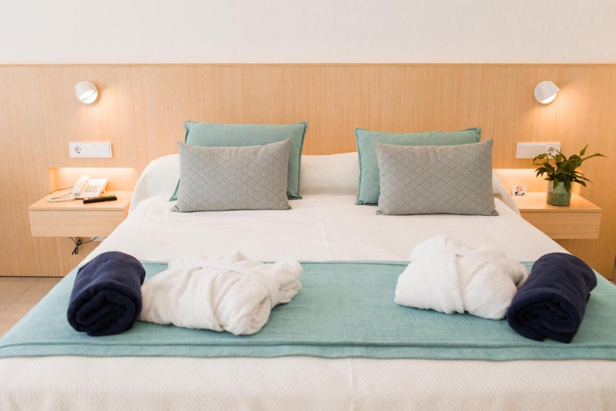 Cama o camas de una habitación en Gran Sagitario