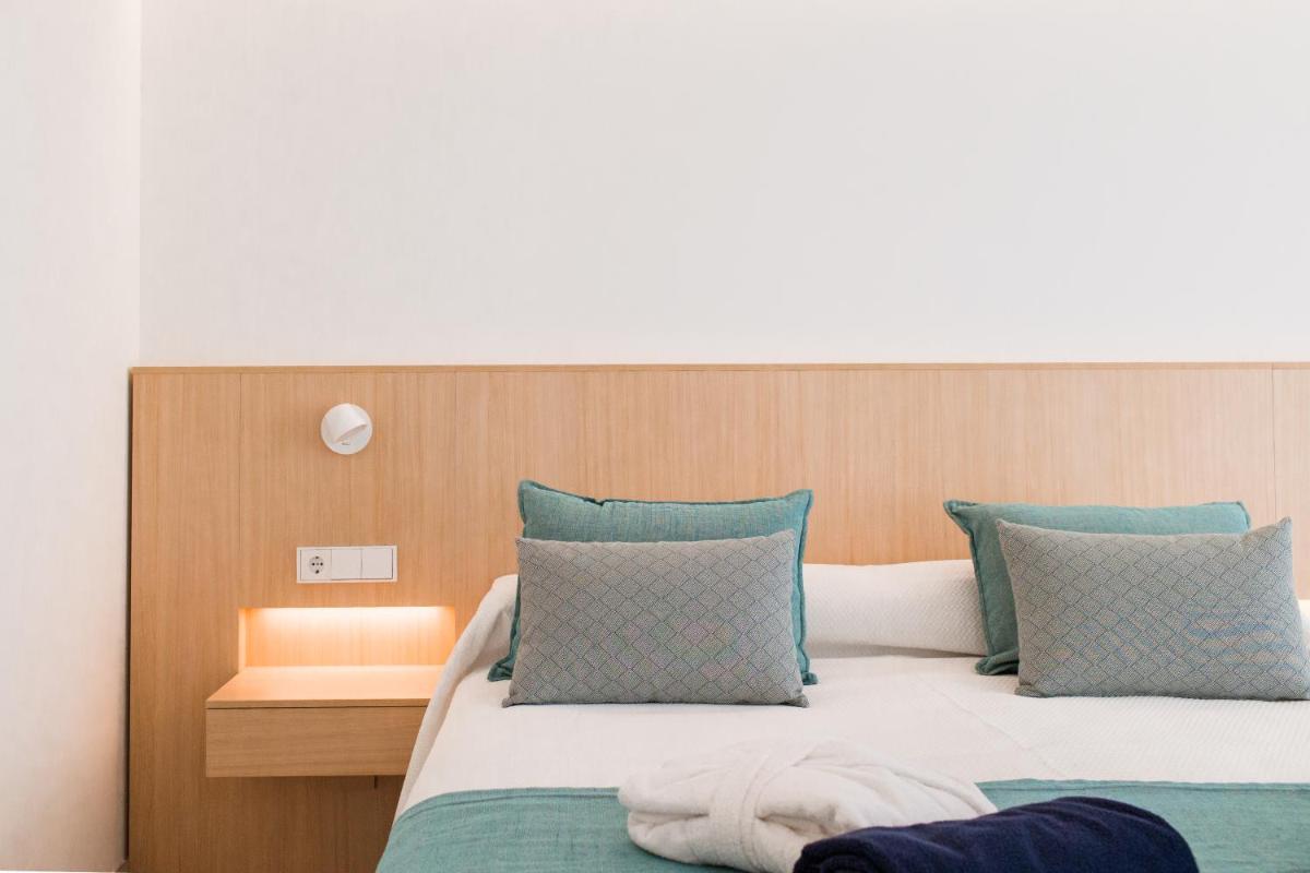 Cama o camas de una habitación en Gran Sagitario