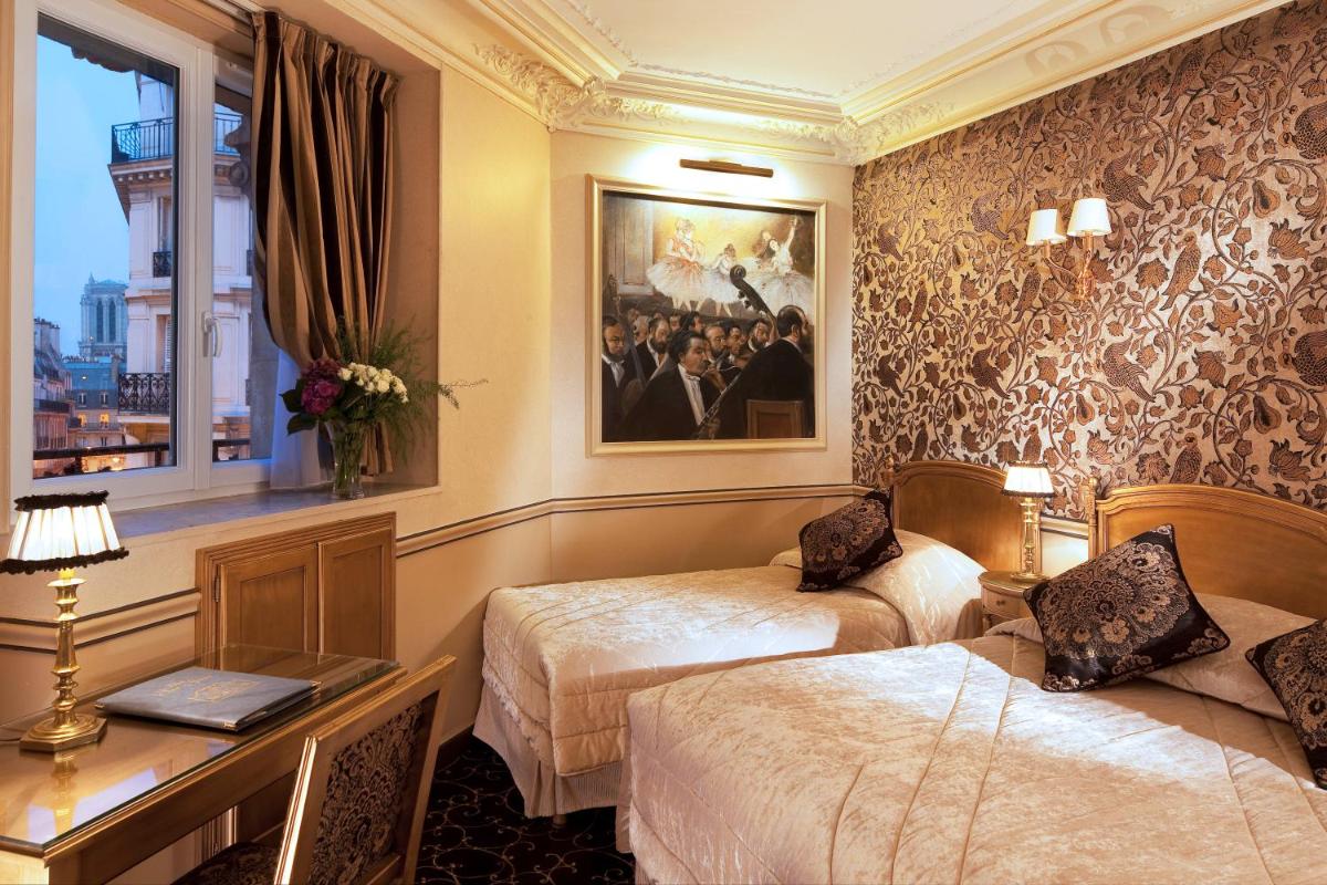 Un ou plusieurs lits dans un hébergement de l'établissement Hotel & Spa Saint-Jacques