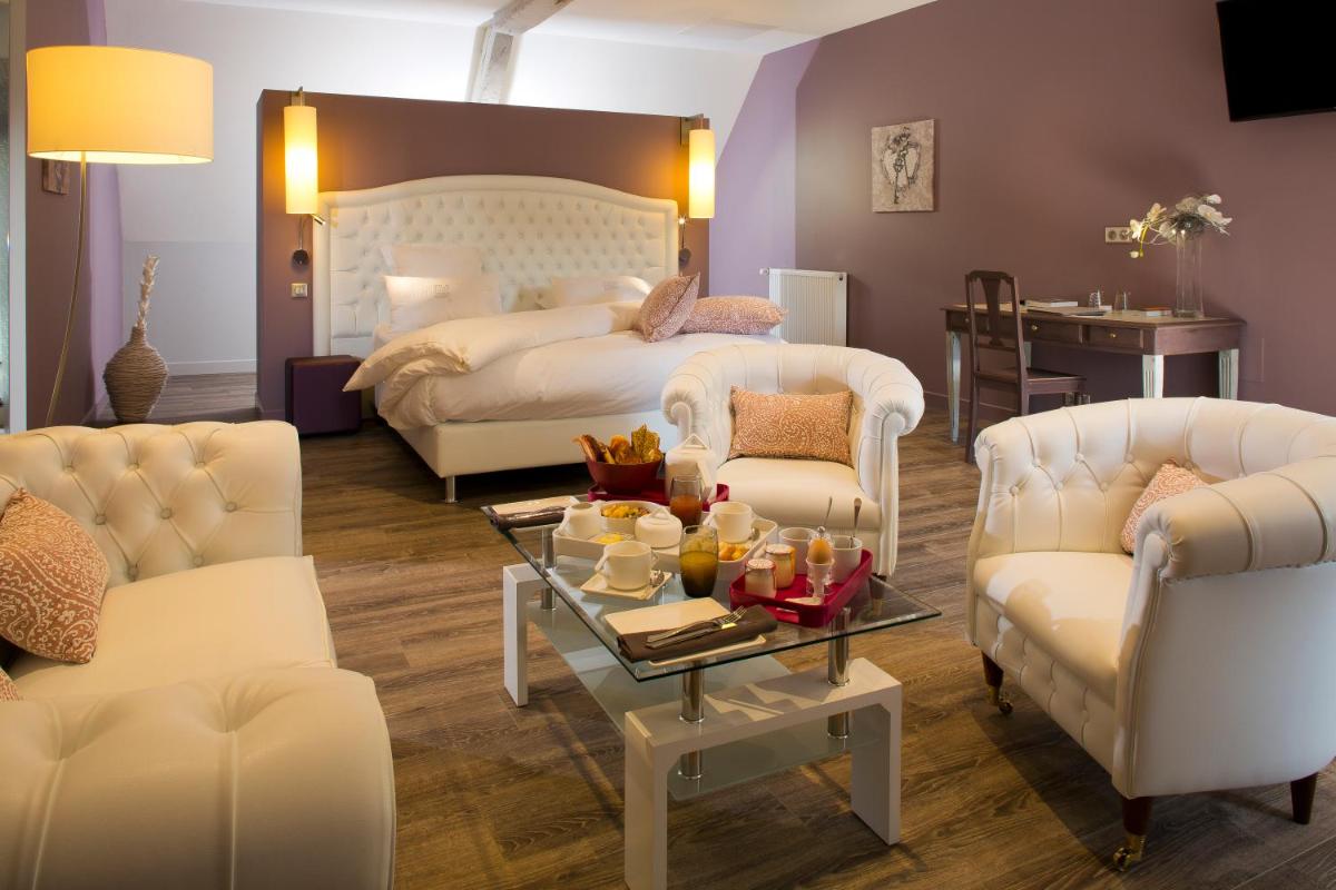 Coin salon dans l'établissement Maison Doucet - Relais & Châteaux