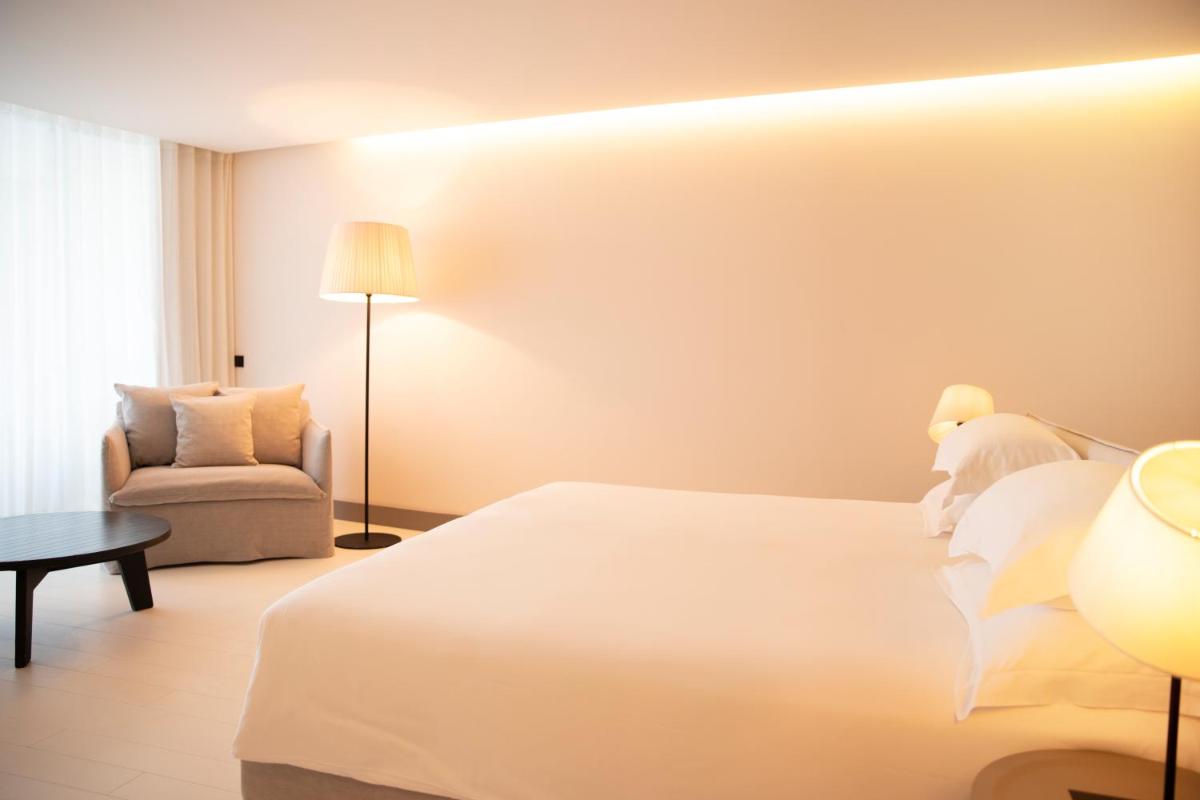 Un ou plusieurs lits dans un hébergement de l'établissement Hôtel Plage Palace & Spa