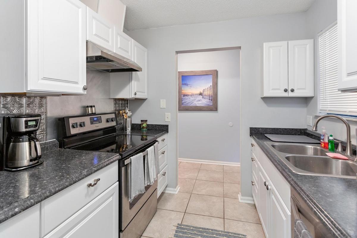 3 bedroom 1 and a half bath townhome with deck over lagoon at Gascoigne Condominiums - Housity