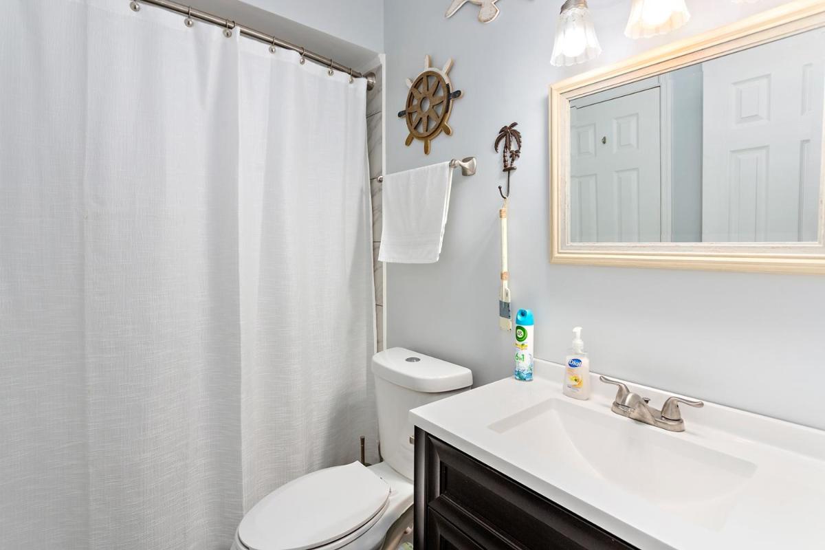 3 bedroom 1 and a half bath townhome with deck over lagoon at Gascoigne Condominiums - Housity