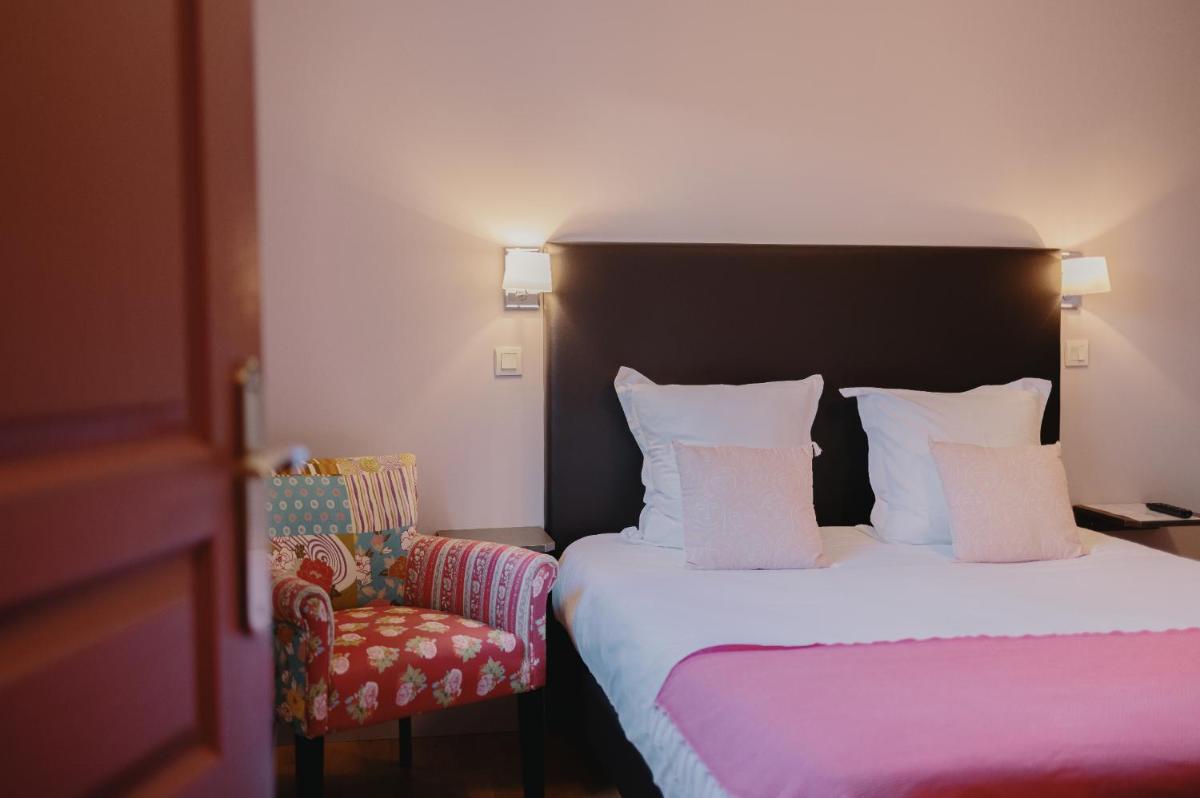 Un ou plusieurs lits dans un hébergement de l'établissement La Fraîchette-Hôtel & Spa