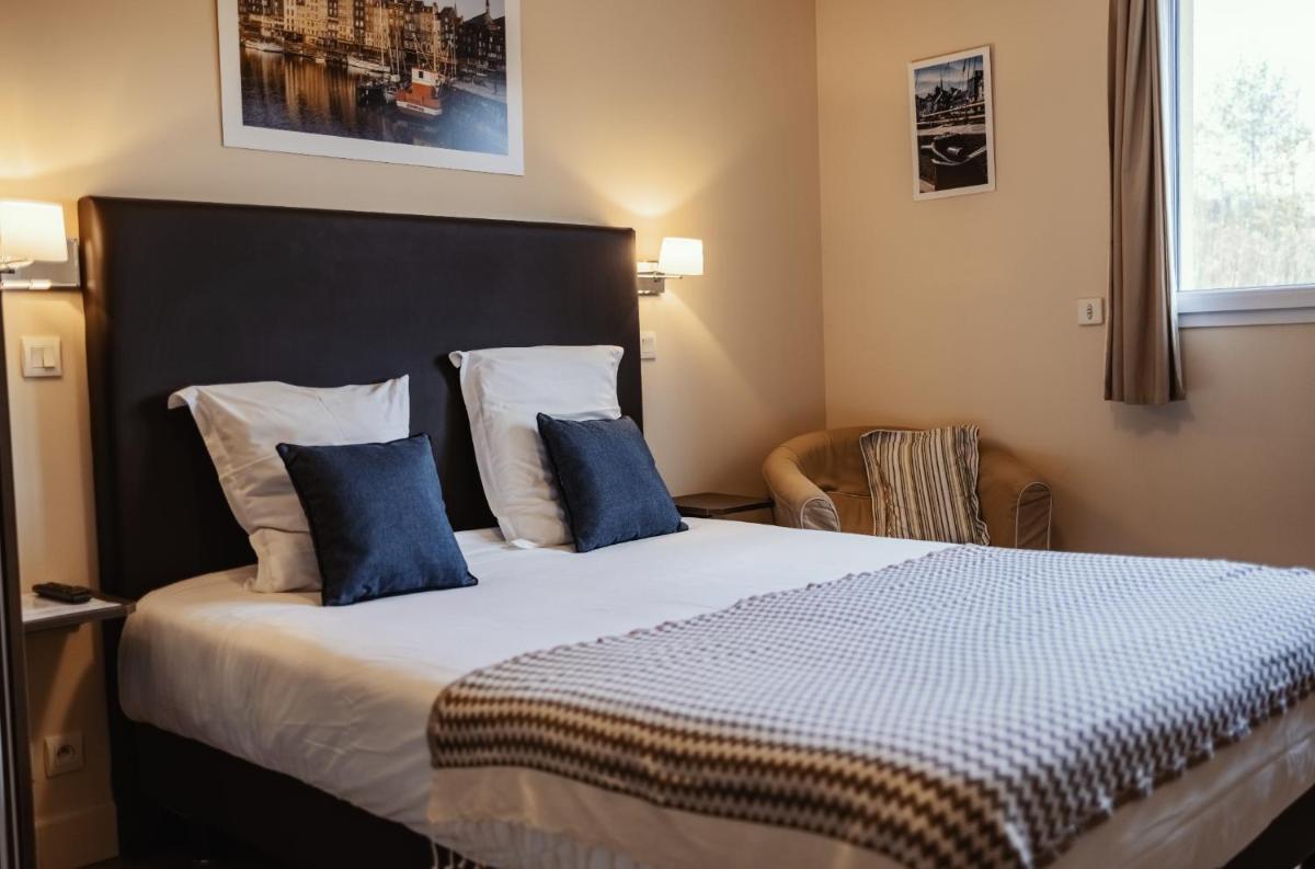 Un ou plusieurs lits dans un hébergement de l'établissement La Fraîchette-Hôtel & Spa