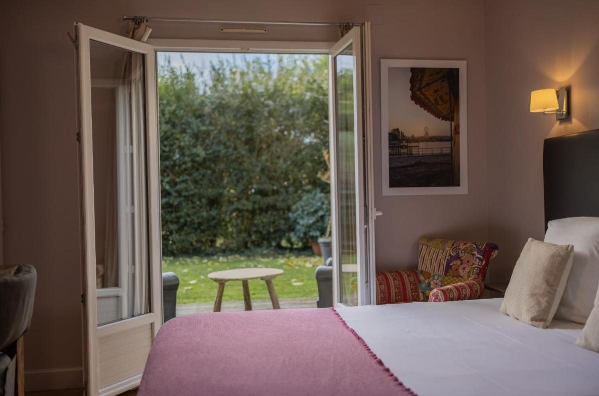 Un ou plusieurs lits dans un hébergement de l'établissement La Fraîchette-Hôtel & Spa