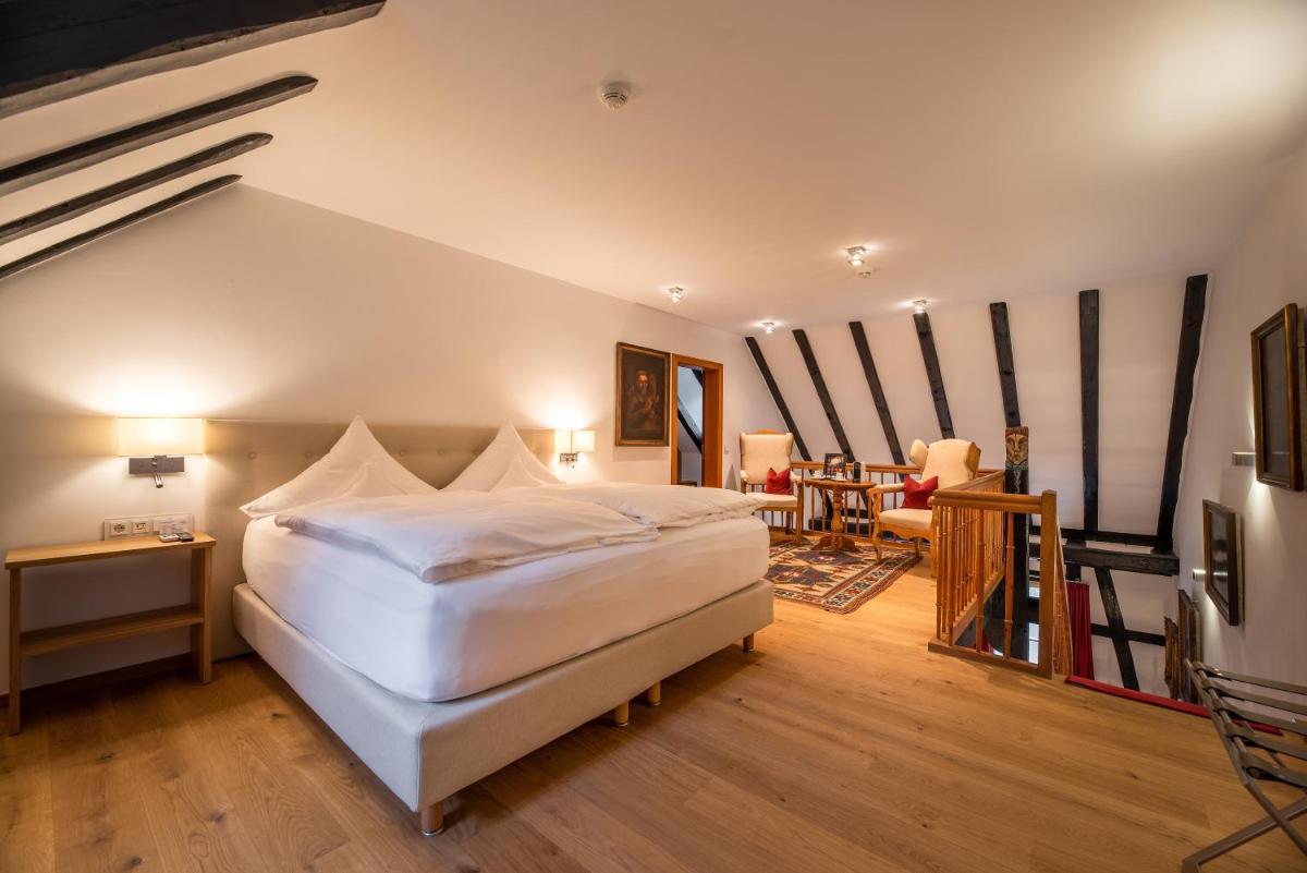 Ein Bett oder Betten in einem Zimmer der Unterkunft Neumühle Resort & Spa