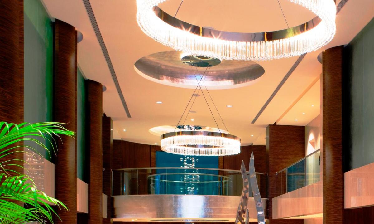 two chandeliers hanging from the ceiling in a store at Blue Diamond Pune IHCL SeleQtions in Pune