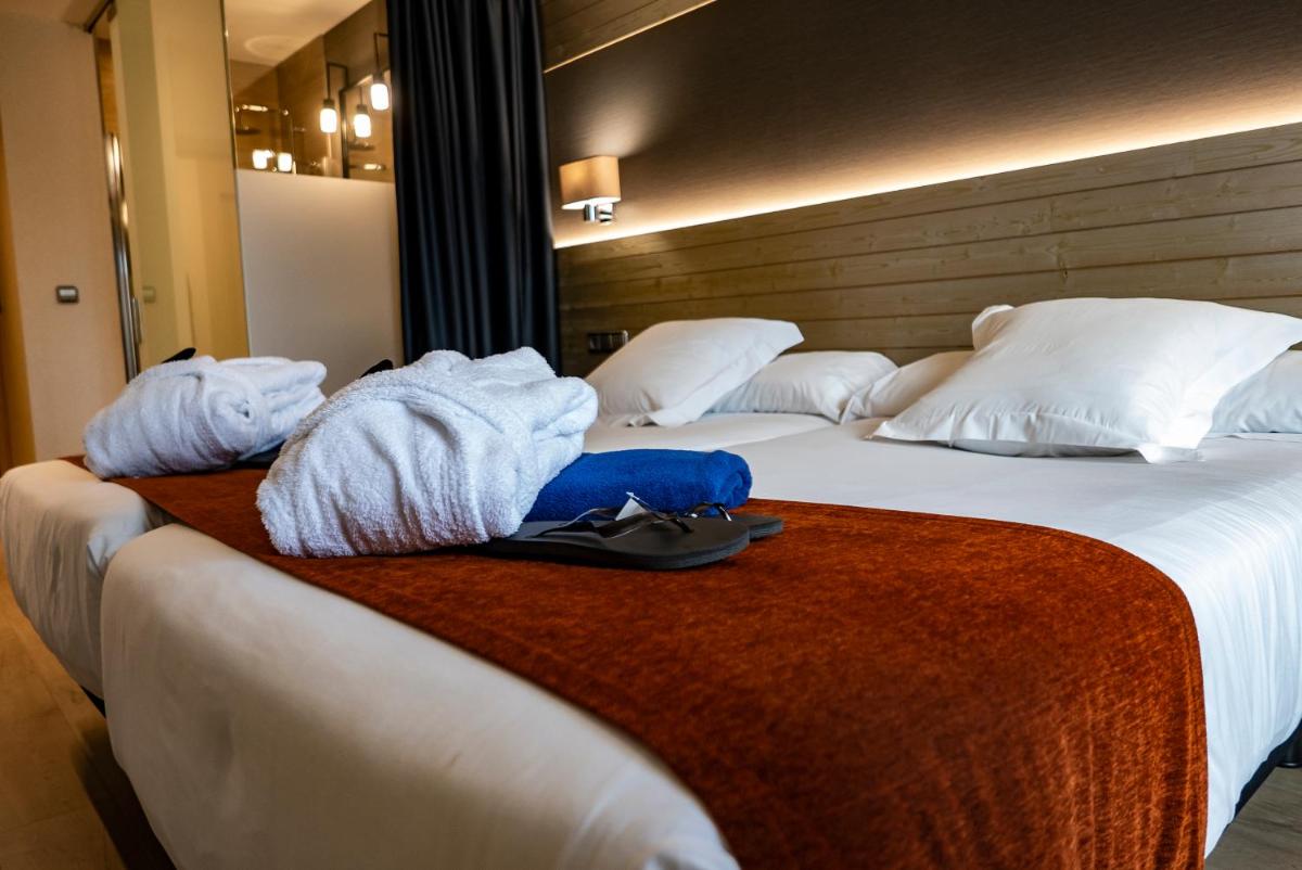 Cama o camas de una habitación en Hotel Avenida