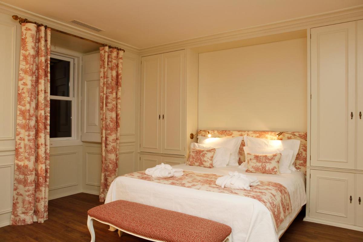 Uma cama ou camas num quarto em Hotel Casa Palmela - Small Luxury Hotels of The World, Hotel & Villas