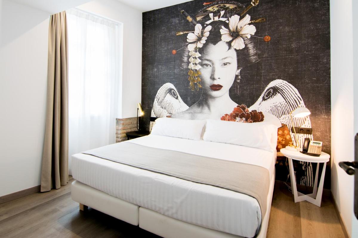 Cama o camas de una habitación en MYR Plaza Mercado & Spa