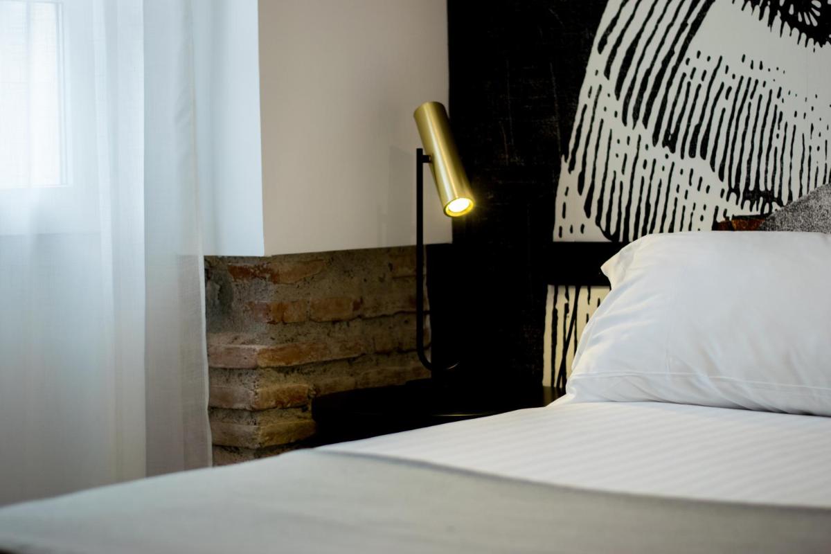 Cama o camas de una habitación en MYR Plaza Mercado & Spa