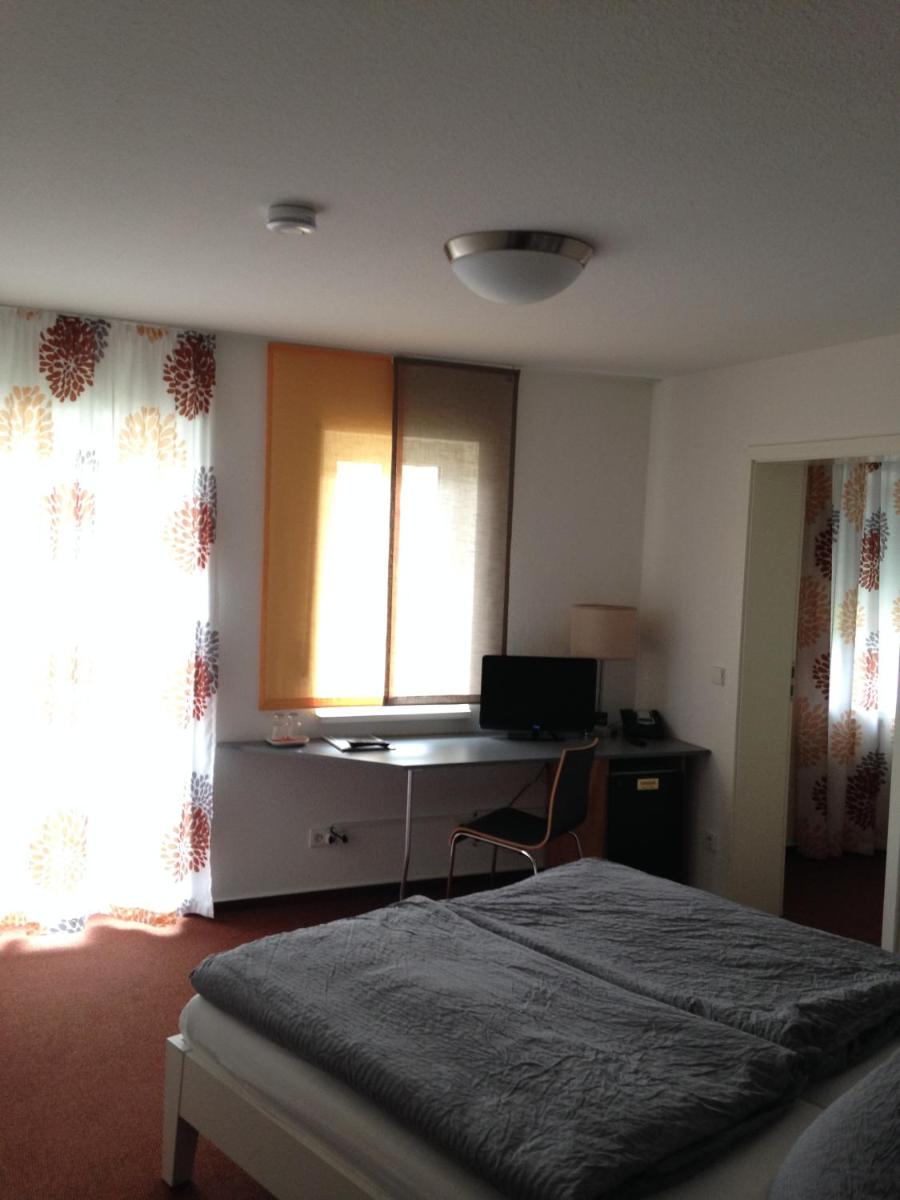 Ein Bett oder Betten in einem Zimmer der Unterkunft Hotel Astra Rastatt