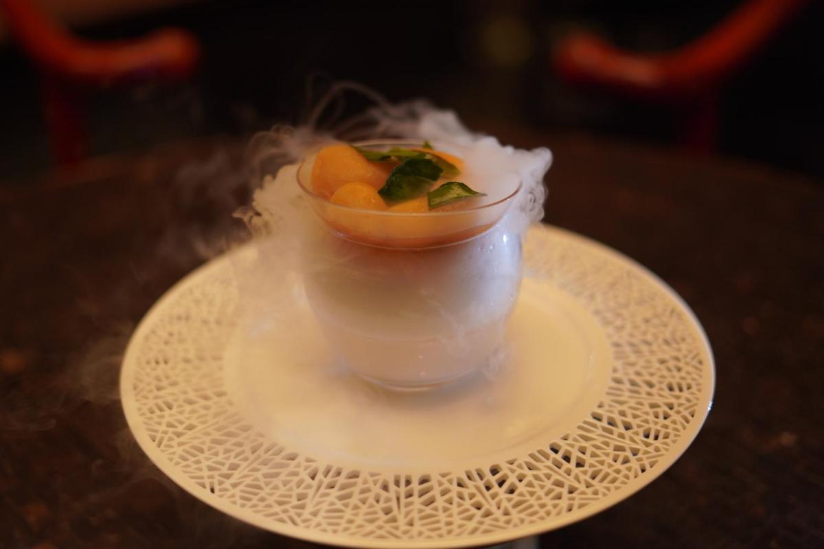 a bowl of fruit on a white plate on a table at InterContinental Jaipur Tonk Road by IHG in Jaipur