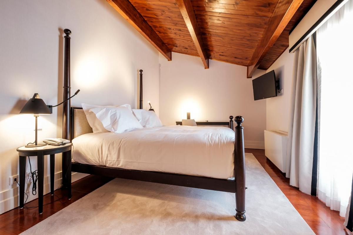 Uma cama ou camas num quarto em Octant Lousa