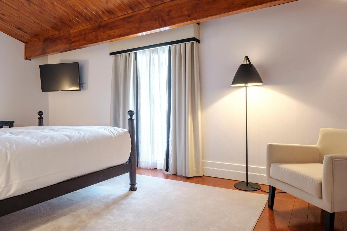 Uma cama ou camas num quarto em Octant Lousa