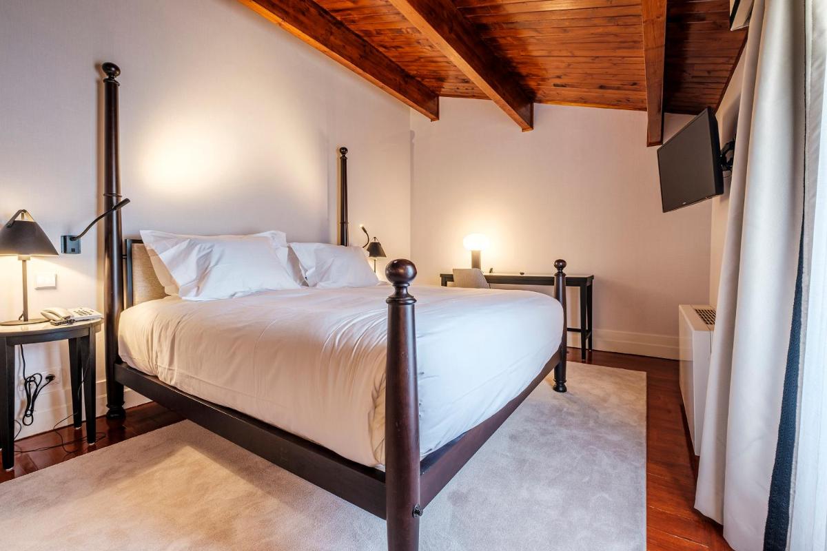 Uma cama ou camas num quarto em Octant Lousa