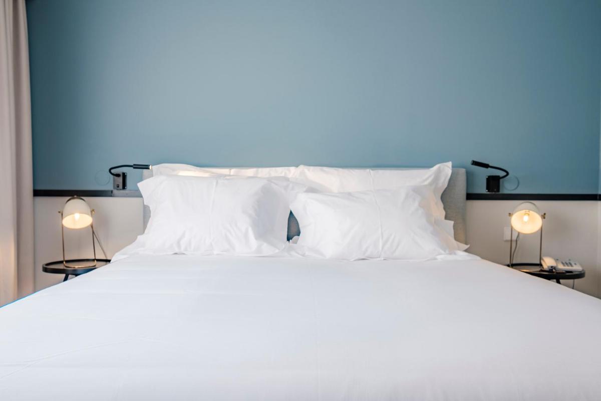Uma cama ou camas num quarto em Octant Lousa
