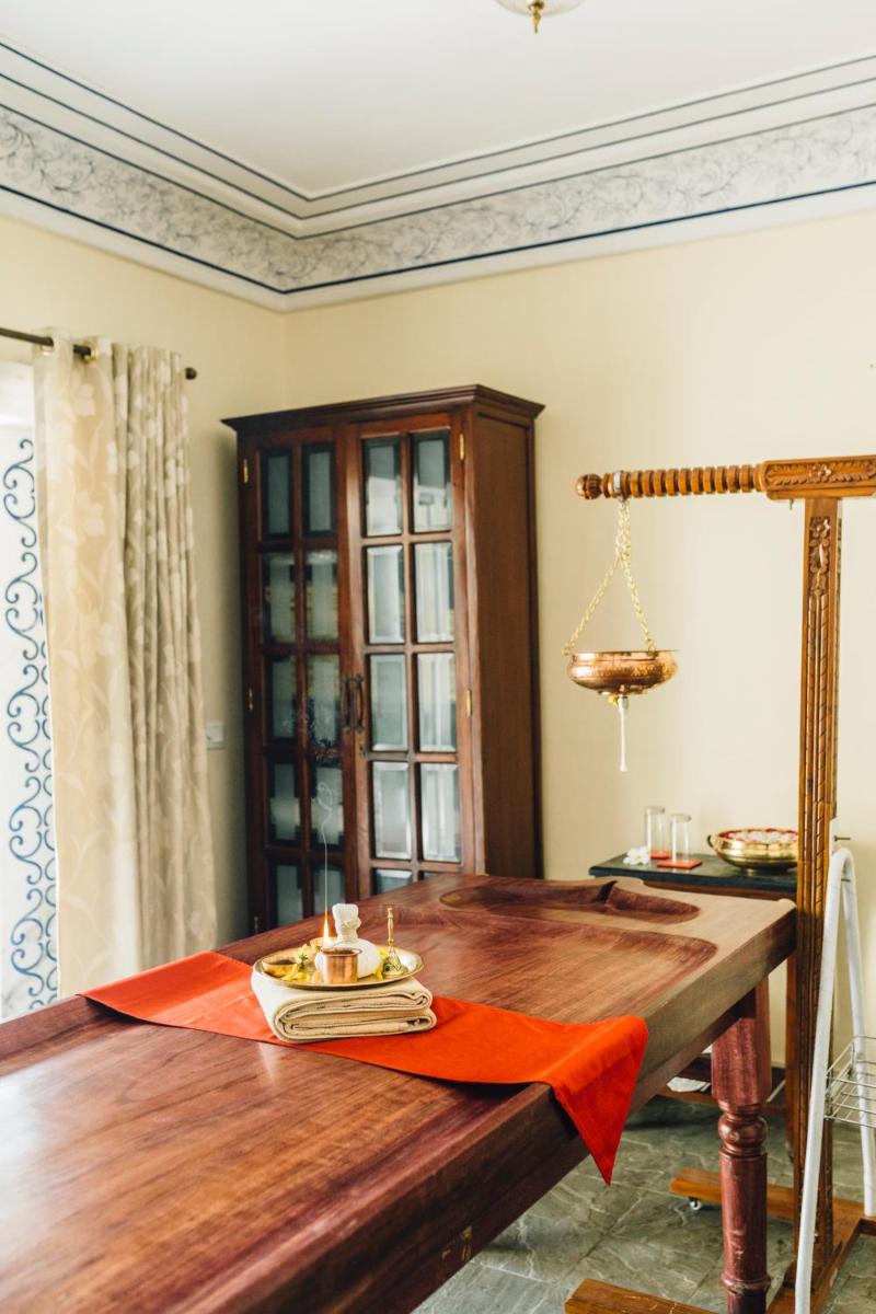 a table with a plate of food on top of it at Royal Heritage Haveli - By Leisure Hotels in Jaipur
