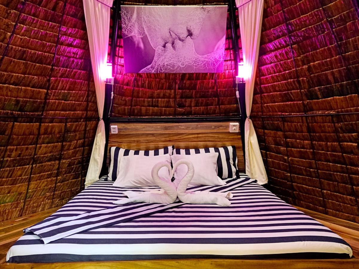 Archery-Asia Nipa Huts Moalboal - Housity