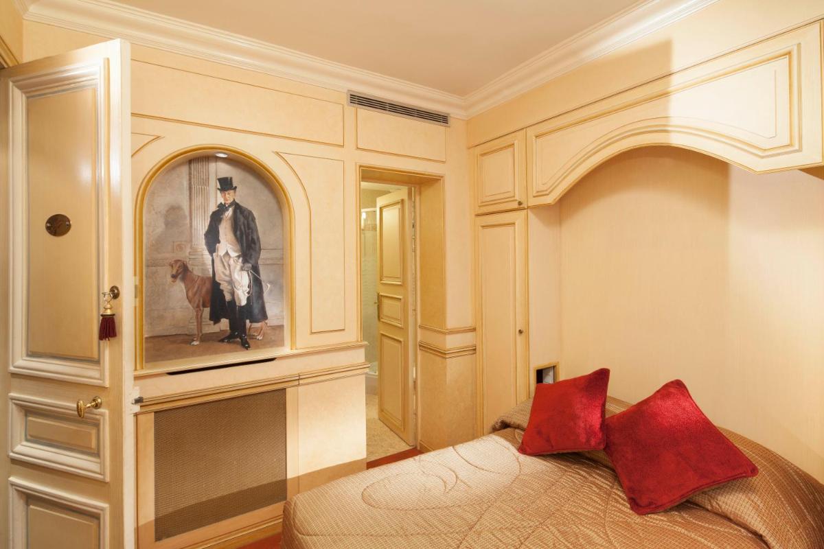 Un ou plusieurs lits dans un hébergement de l'établissement Hotel & Spa Saint-Jacques