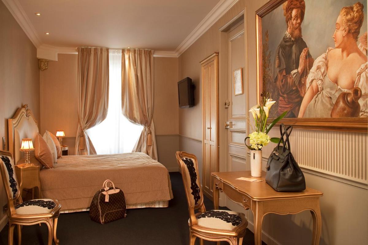 Un ou plusieurs lits dans un hébergement de l'établissement Hotel & Spa Saint-Jacques