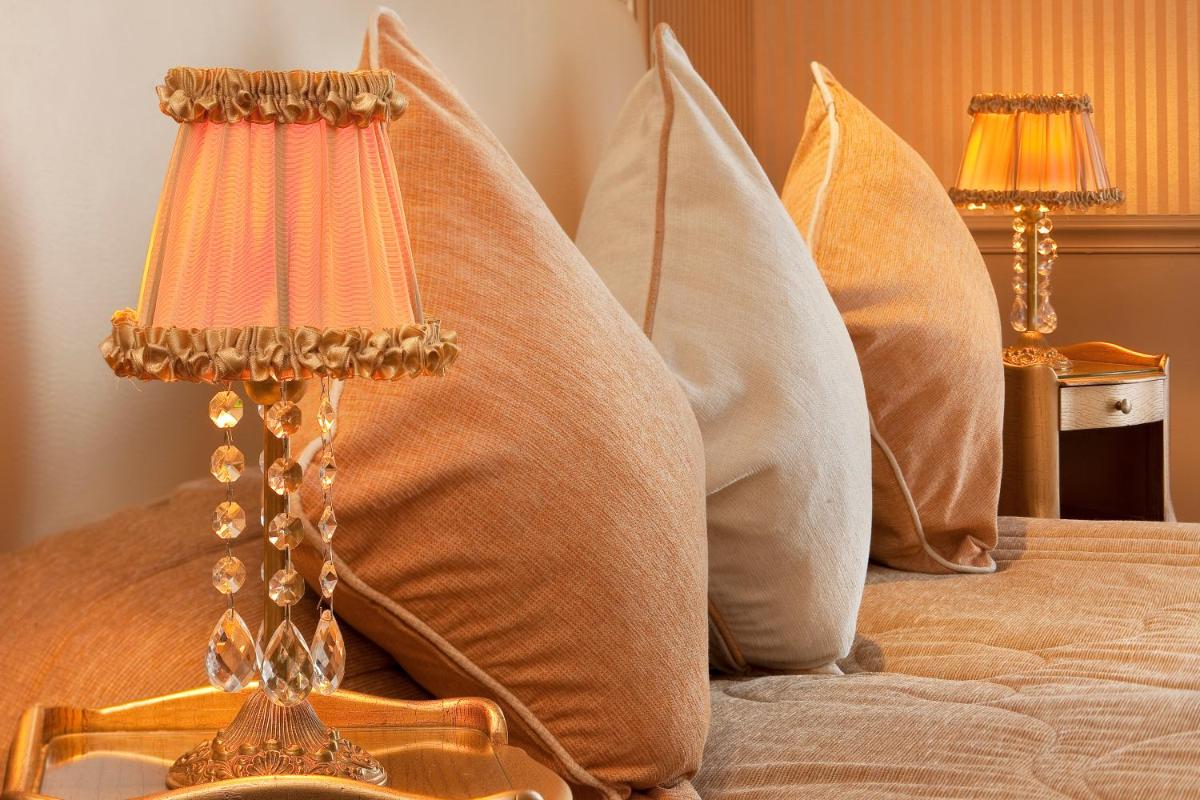 Un ou plusieurs lits dans un hébergement de l'établissement Hotel & Spa Saint-Jacques
