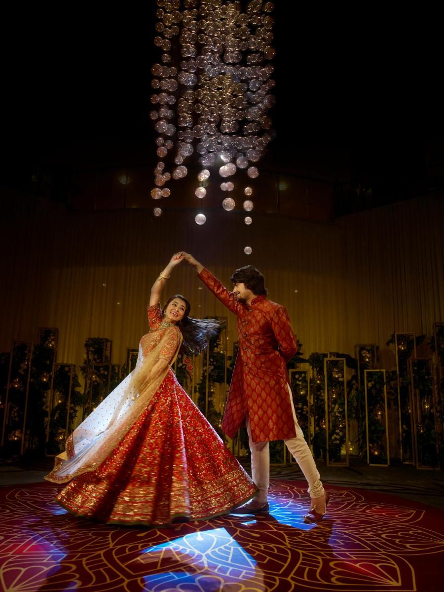 a man and a woman dancing on a stage at Hyatt Place Gurgaon Udyog Vihar in Gurgaon
