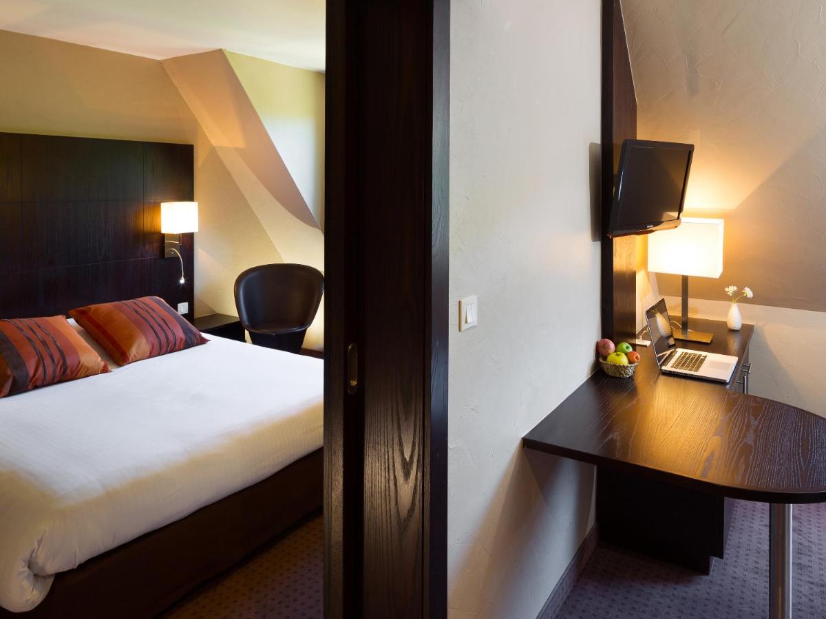 Un ou plusieurs lits dans un hébergement de l'établissement Hotel Restaurant & Spa Verte Vallée