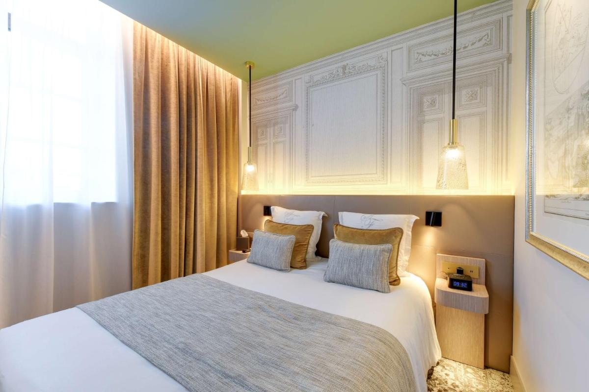 Un ou plusieurs lits dans un hébergement de l'établissement Hôtel & Spa Les Sept Fontaines Best Western Premier