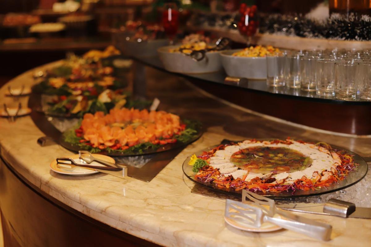 a buffet line with many different types of food at Holiday Inn Jaipur City Centre by IHG in Jaipur a buffet line with many different types of food at Holiday Inn Jaipur City Centre by IHG in Jaipur