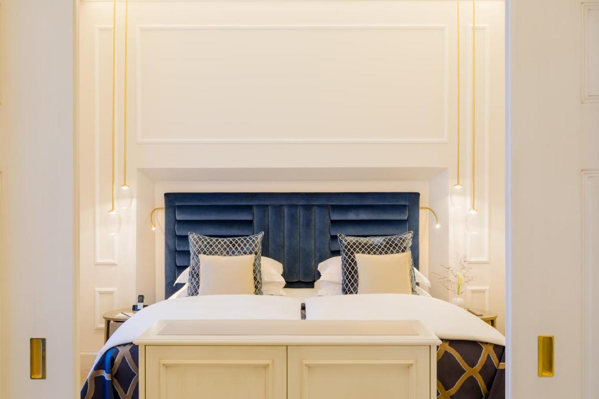 Ein Bett oder Betten in einem Zimmer der Unterkunft Excelsior Hotel Ernst am Dom