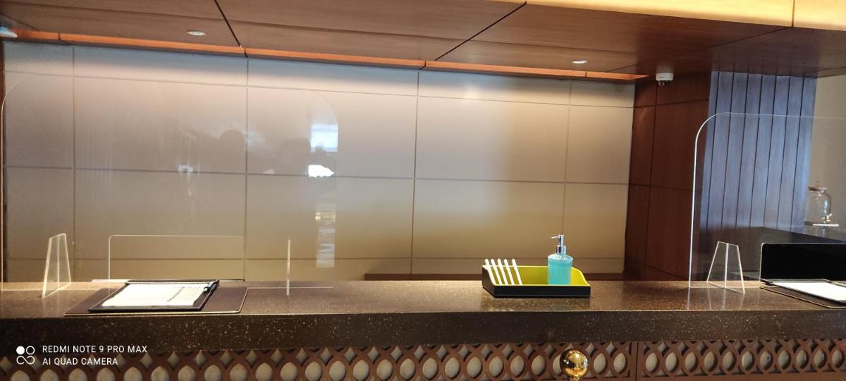 a counter in a room with a mirror at Radisson Kufri in Shimla