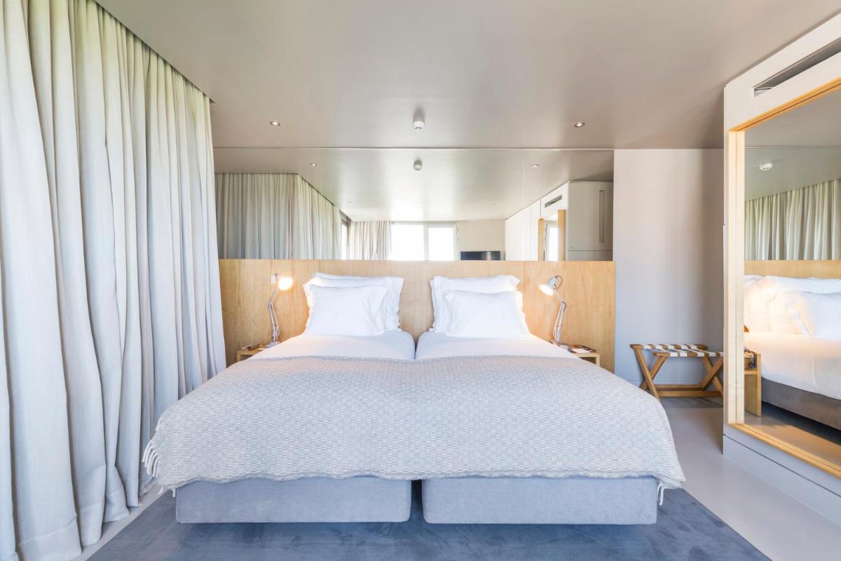 Uma cama ou camas num quarto em Villa C Boutique Hotel
